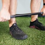 High school baseball player performing deadlifts to build lower-body strength.